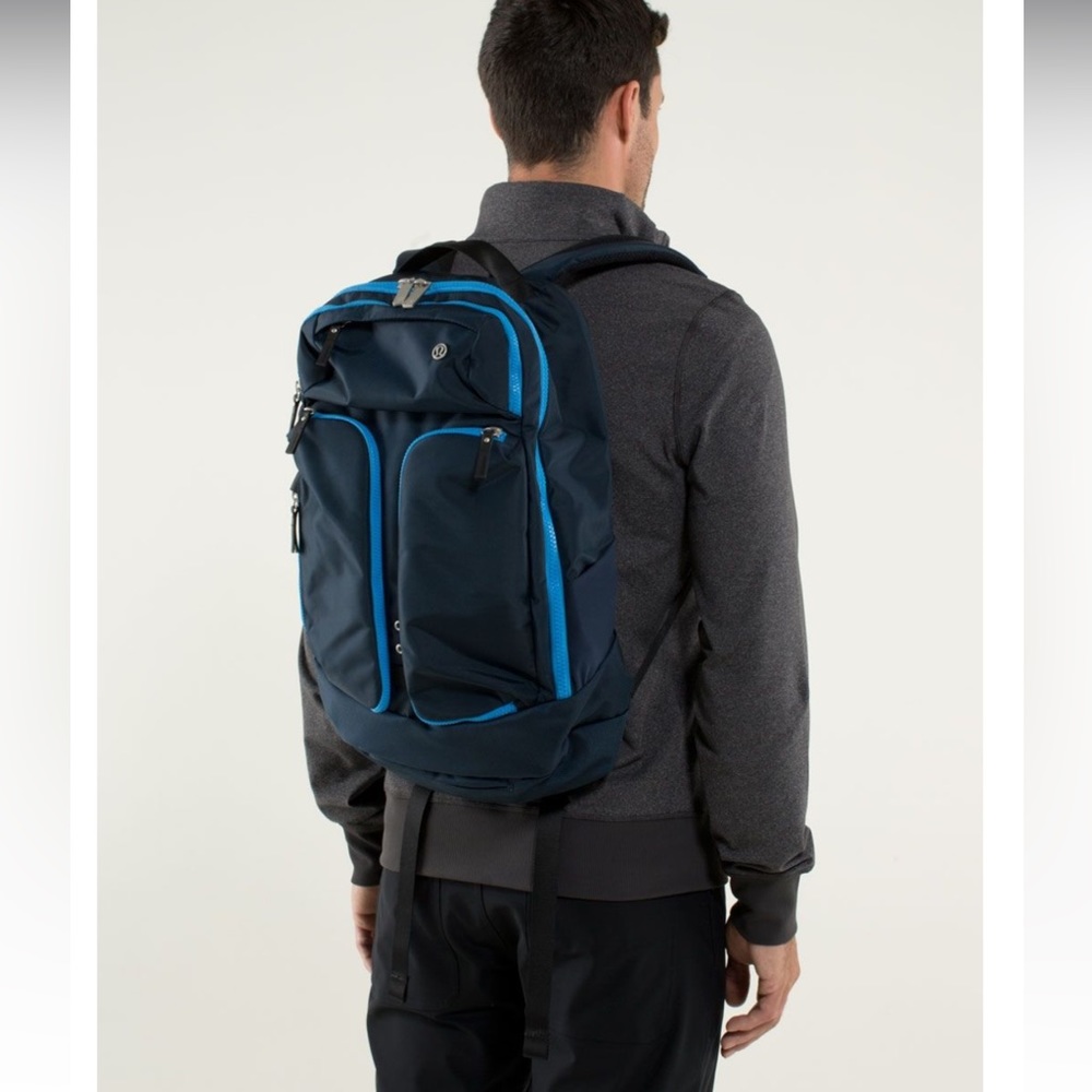 lululemon athletica Navy Backpack. Solid black. Stock picture is with blue trim